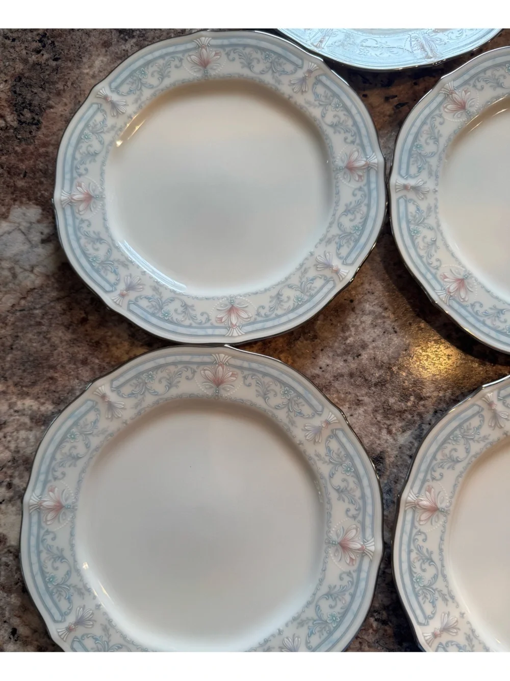 Noritake Crown Flower Dinnerware with Pale Blue and Soft Pink Floral Border